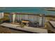 Aerial view of a waterfront condo building with covered parking and tropical landscaping at 9 Forbes Pl # 512, Dunedin, FL 34698