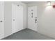 Exterior view of a condo entrance featuring a door with the number 512 and a decorative knocker at 9 Forbes Pl # 512, Dunedin, FL 34698