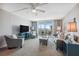 Comfortable living room with neutral tones, a ceiling fan and a large window with waterfront view at 9 Forbes Pl # 512, Dunedin, FL 34698