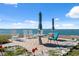 Relaxing outdoor seating area with rocking chairs, tables, and views of the ocean at 9 Forbes Pl # 512, Dunedin, FL 34698