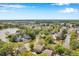 Aerial view of the community surrounded by a lake and lush greenery offering a serene setting at 9046 Lake Place Ln # 9046, Tampa, FL 33634