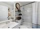 Bright bathroom featuring a tub with white marble surround, decorative shelving, and updated fixtures at 9046 Lake Place Ln # 9046, Tampa, FL 33634