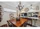 Stylish dining room featuring a custom table, chandelier, decorative elements and bar area at 9046 Lake Place Ln # 9046, Tampa, FL 33634