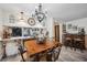 Elegant dining room with custom table, seating, chandelier and decorative bar area at 9046 Lake Place Ln # 9046, Tampa, FL 33634