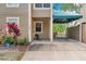 Welcoming entrance with covered parking, decorative plants, and a well-kept walkway at 9046 Lake Place Ln # 9046, Tampa, FL 33634