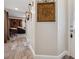 Inviting hallway with stylish decor, wood-look floors, and an open flow to the living area at 9046 Lake Place Ln # 9046, Tampa, FL 33634