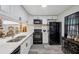 Contemporary kitchen featuring white cabinets, sleek black appliances, and a stylish countertop design at 9046 Lake Place Ln # 9046, Tampa, FL 33634