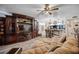Open living area showcasing a cozy sofa, custom entertainment center and connected bar area at 9046 Lake Place Ln # 9046, Tampa, FL 33634