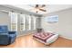 Cozy bedroom with many windows and a ceiling fan providing ample natural light and ventilation at 9545 Sunshine Blvd, New Port Richey, FL 34654