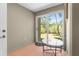 Bright sun room with sliding glass door offering a seamless transition to the outdoors at 9545 Sunshine Blvd, New Port Richey, FL 34654
