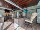 Well-equipped outdoor kitchen and bar area, perfect for cooking and dining al fresco while enjoying the beautiful weather at 10136 Highcrest Ln, New Port Richey, FL 34654