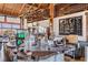 Rustic market interior with log counters, baked goods, drink selections, and menu board at 10356 Fenceline Rd, New Port Richey, FL 34655