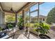 Screened patio with a dining area and view of backyard at 10356 Fenceline Rd, New Port Richey, FL 34655