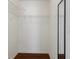 Walk-in closet with wire shelving and a full-length mirror at 1038 Greenturf Rd, Spring Hill, FL 34608