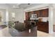 Well-lit kitchen with a large island, granite countertops, stainless steel appliances, and plentiful storage space at 1038 Greenturf Rd, Spring Hill, FL 34608