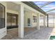 Outdoor patio with brick pavers and white support columns provides a relaxing poolside retreat at 1038 Greenturf Rd, Spring Hill, FL 34608