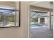 A view from inside to the outside pool area at 1038 Greenturf Rd, Spring Hill, FL 34608