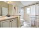 Bathroom with vanity, tiled shower and toilet at 11428 Hidden Cove Ct, Trinity, FL 34655