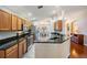 Well-appointed kitchen with stainless steel appliances, granite countertops and ample cabinet space at 11428 Hidden Cove Ct, Trinity, FL 34655