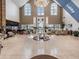 Elegant lobby with high ceilings, large windows, and comfortable seating areas at 11428 Hidden Cove Ct, Trinity, FL 34655