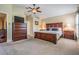 Spacious main bedroom featuring plush carpet and a luxurious wood bedroom set at 11428 Hidden Cove Ct, Trinity, FL 34655