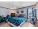 The bedroom features a ceiling fan, and a window for natural light at 12467 Montego St, Spring Hill, FL 34609