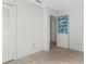 This room offers a closet and doorway, painted walls, and neutral-colored flooring at 12467 Montego St, Spring Hill, FL 34609