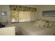 Bright bedroom with a large window and comfortable bedding at 12820 Wedgewood Way # D, Hudson, FL 34667