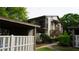 Exterior of a townhouse with a covered parking area, a private balcony, and a cozy patio area at 12820 Wedgewood Way # D, Hudson, FL 34667