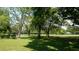 Scenic community green space boasting mature shade trees and manicured lawn at 12820 Wedgewood Way # D, Hudson, FL 34667