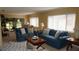 Bright living room with large windows, plush seating, and a cozy atmosphere at 12820 Wedgewood Way # D, Hudson, FL 34667