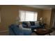 Bright living room with large windows, comfortable seating, and stylish lamps for a cozy atmosphere at 12820 Wedgewood Way # D, Hudson, FL 34667