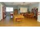 Community meeting room with wood tables and bookshelves at 12820 Wedgewood Way # D, Hudson, FL 34667