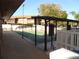 Community shuffleboard courts with shaded seating areas, perfect for outdoor recreation and social gatherings at 12820 Wedgewood Way # D, Hudson, FL 34667