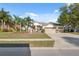 Charming single-story home features a three-car garage, lush landscaping, and a well-manicured lawn at 1312 Lake Polo Dr, Odessa, FL 33556