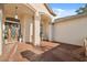 Inviting front porch features brick flooring and classic architectural details at 1312 Lake Polo Dr, Odessa, FL 33556