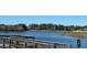 Community fishing pier over the lake, offering scenic waterfront views at 13648 Crest Lake Dr, Hudson, FL 34669