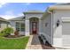 This home features a beautiful red front door, with great landscaping and walkway at 14604 Strathglass Dr, Hudson, FL 34667