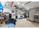 Spacious garage equipped with storage solutions, work area, and appliances at 14604 Strathglass Dr, Hudson, FL 34667