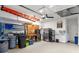 Well-organized garage featuring a work area, storage, and appliances at 14604 Strathglass Dr, Hudson, FL 34667