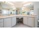 Bathroom featuring double sinks, lots of countertop space, and vanity seating at 1809 Westerham Loop, Trinity, FL 34655