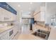 Bright kitchen featuring white cabinets, modern appliances, and a view into the dining area at 1809 Westerham Loop, Trinity, FL 34655