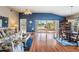 Inviting living room with hardwood floors, comfortable furniture, and sliding glass doors leading to outdoor living spaces at 1809 Westerham Loop, Trinity, FL 34655