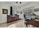 Office with hardwood floors and a view of the screened-in pool at 18606 Kuka Ln, Spring Hill, FL 34610