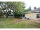 A lovely backyard featuring a screened pool enclosure and well-maintained lawn at 19109 Beckett Dr, Odessa, FL 33556