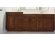 Bathroom vanity with dual sinks and dark wood cabinets at 19109 Beckett Dr, Odessa, FL 33556