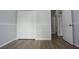Bedroom with a closet featuring wood-style flooring at 19109 Beckett Dr, Odessa, FL 33556