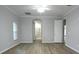 Bedroom with wood floors, and doorway to bathroom at 19109 Beckett Dr, Odessa, FL 33556