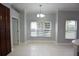 Sunlit dining area with tile flooring, neutral walls and window at 19109 Beckett Dr, Odessa, FL 33556