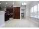 Dining area showcasing a chandelier, multiple windows, and access to the kitchen at 19109 Beckett Dr, Odessa, FL 33556